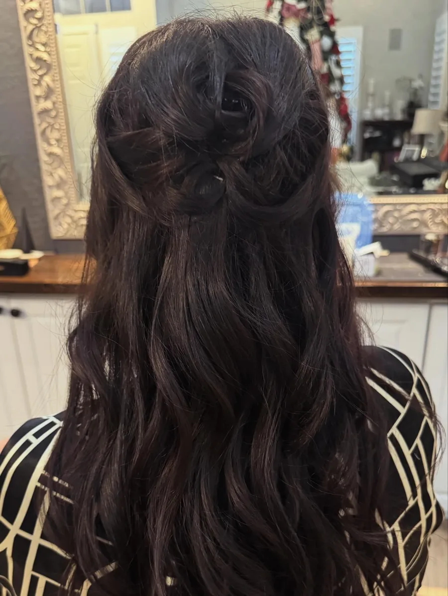 Lived-in color and soft waves styled by Hair by Shae